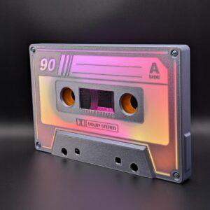 The Iconic Audio Cassette | Grey and White - Animated LED Nightlight features a translucent shell, tape reels, and vintage deck details, labeled “90” and “A side,” set against a black background for a retro-inspired look.