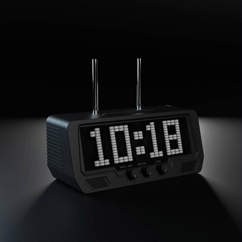 The Audio Visualizer Pro shows 10:18 in bold white digits on its LED display, set within a sleek, black speaker-panel background.