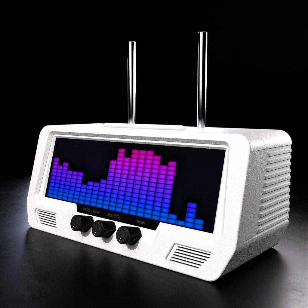 A retro-style white radio features a vibrant digital equalizer on its LCD screen, with rotary control knobs and audio dials below.