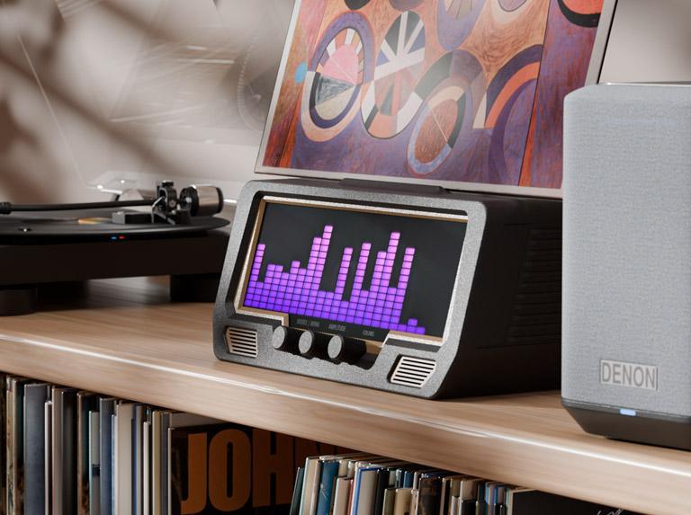 The Audio Visualizer Pro is a modern black radio...