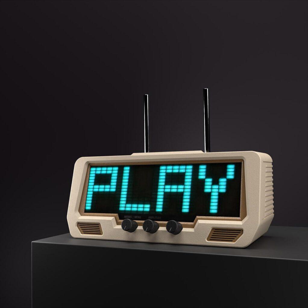 A vintage-style digital receiver with twin vinyl support acts as an audio visualizer EQ, showing PLAY in blue-green on its LED display.